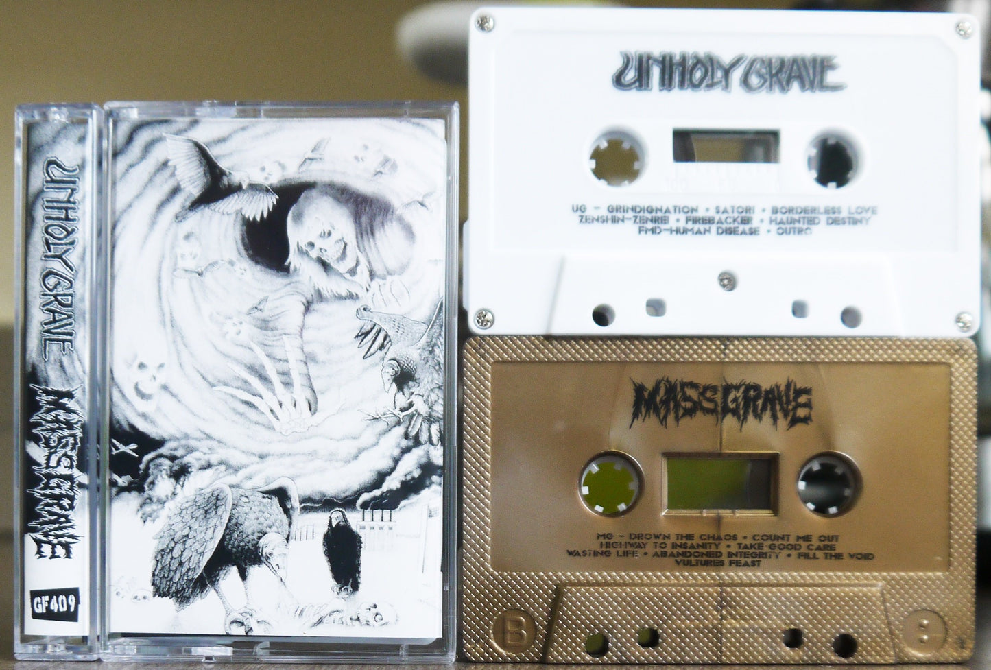 UNHOLY GRAVE / MASSGRAVE - Split Tape